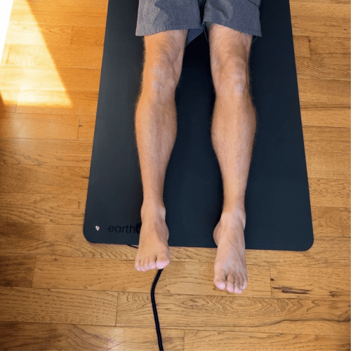 Brad Lying On The Earthing Single Sided Grounded Yoga Mat